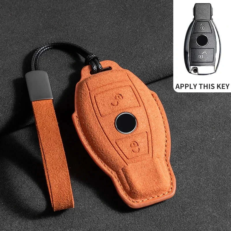 Suede leather key fob case Mercedes Benz with a sleek design, showcasing a tan color and a secure strap.