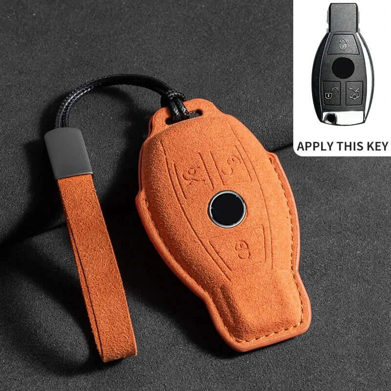 Suede leather key fob case Mercedes Benz for remote with orange design and key button cutout.
