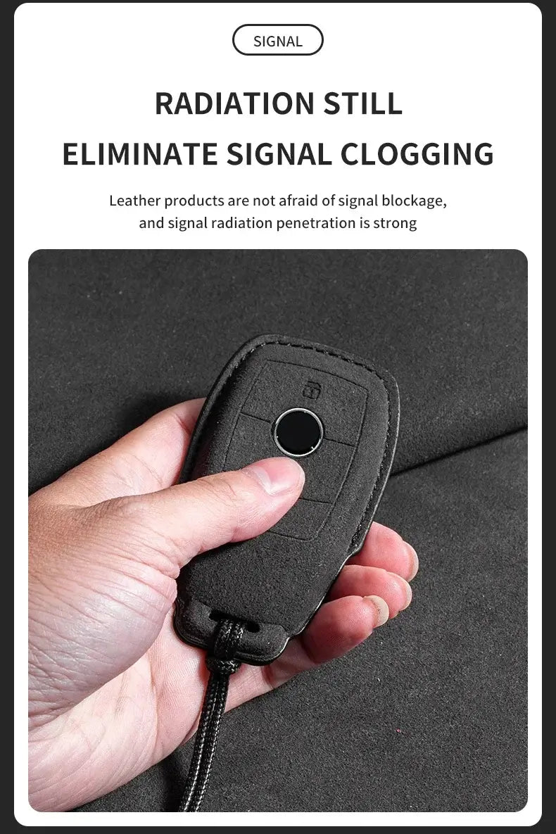 Hand holding a suede leather key fob case Mercedes Benz showing signal penetration and anti-signal blockage features.