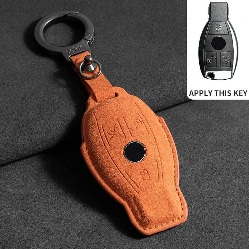 Suede leather key fob case Mercedes Benz in orange color with key ring for secure attachment.