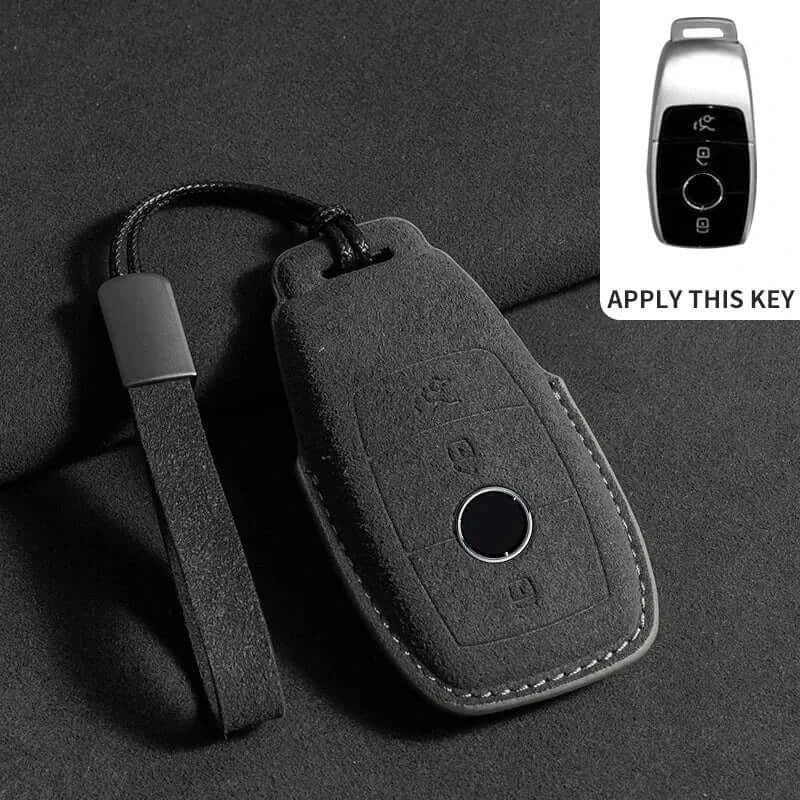 suede leather key fob case Mercedes Benz remote key in sleek design with strap on dark background